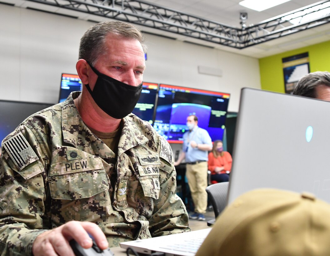 IMAGE: Naval Surface Warfare Center Dahlgren Division (NSWCDD) Commanding Officer Capt. Stephen “Casey” Plew, plays Simulated Practice Integrating New Technologies (SPRINT) during a wargaming event at NSWCDD. SPRINT is a game which allows users to defend their designated ship using an array of weapons systems.