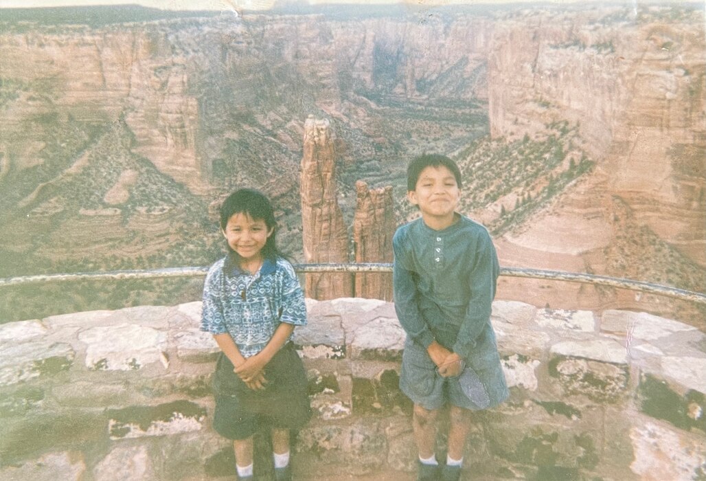 Airman 1st Class Verneon Reed, 319th Aircraft Maintenance Squadron Detachment 1 RQ-4 Global Hawk maintainer poses for a photo with his brother in 1992 at Canyon de Chelly National Monument, Arizona.