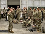 Command Sergeant Major Benjamin Jones of U.S. Southern Command speaks to participants ahead of the Norwegian Foot March at Homestead Air Reserve Base, Florida, on Nov. 19, 2021.