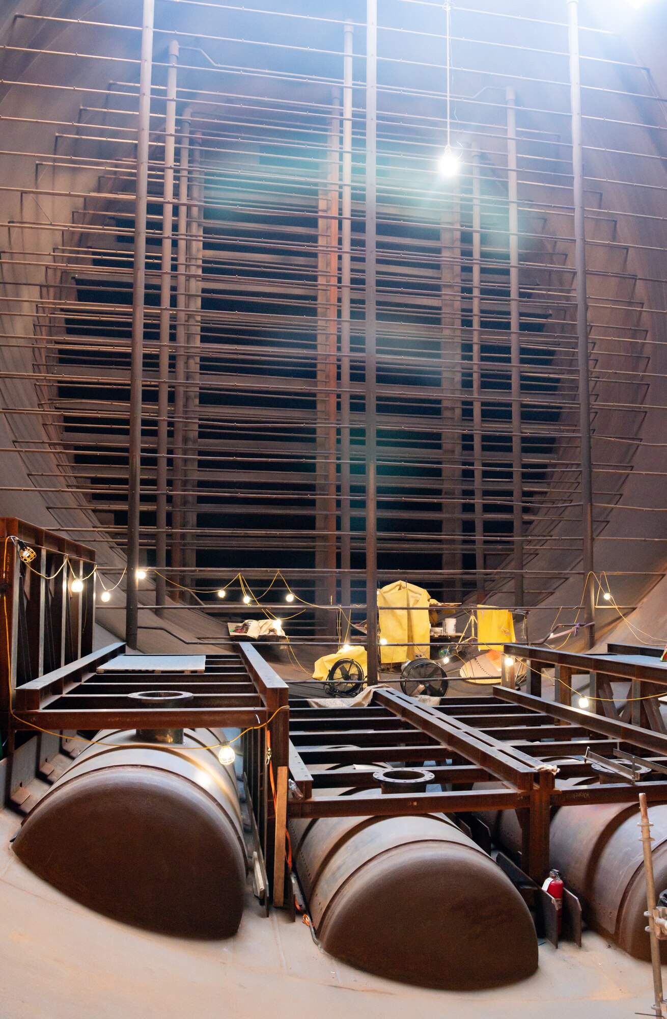 Heat exchangers will be installed on the framework, shown in this image taken Sept. 14, 2021, at Arnold Air Force Base, Tenn., inside of exhaust cooler 1 of the Aeropropulsion Systems Test Facility to increase the volume of exhaust that can be cooled in the time it takes for it to flow from the test cells to the exhausters. The heat exchangers are part of the Next Generation Turbine Engine Test Capability project to restore capability lost through aging of the facility and increase capability. (U.S. Air Force photo by Jill Pickett)