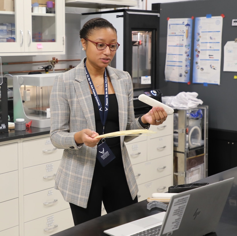 Dr. Roneisha Haney shows the students lightweight aircraft components made by additive manufacturing. The presentation was virtual because of COVID-19 restrictions. (U.S. Air Force photo/Wesley Deer)
