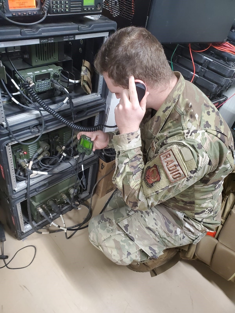 Senior Airman Cody Rowley, 776th Expeditionary Air Base Squadron radio and satellite communications technician, attempts making a high frequency radio call to another station during Noble Skywave Global HF competition at Chabelley Airfield, Djibouti, Oct 27, 2021. Noble Skywave is a 60-hour event, where teams have to demonstrate the ability to make HF radio transmission around the world. (U.S. Air Force Courtesy Photo)