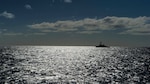 The guided missile destroyer USS Arleigh Burke (DDG 51) transits the Atlantic Ocean.