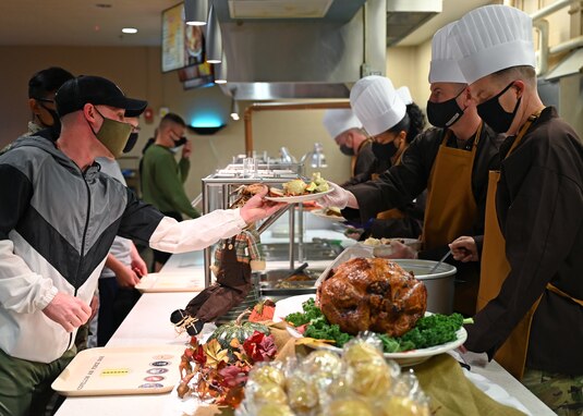 17th Training Wing leaders serve military members from around the community during Thanksgiving at the Western Winds Dining Facility on Goodfellow Air Force Base, Texas, Nov. 25, 2021. More than 400 military personnel, veterans and family members were served before noon. (U.S. Air Force photo by Senior Airman Ethan Sherwood)