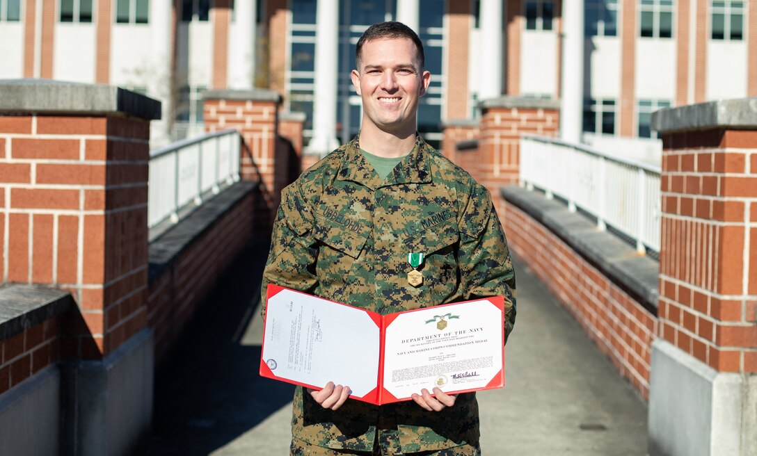 He descended into the drainage canal and retrieved the child, fearing the child was in danger. Ubbelohde remained with the child until emergency services arrived. Due to the courageous actions of Ubbelohde, the child was unharmed and safely reunited with his family. (U.S. Marine Corps photo by Lance Cpl. Lauren Salmon)