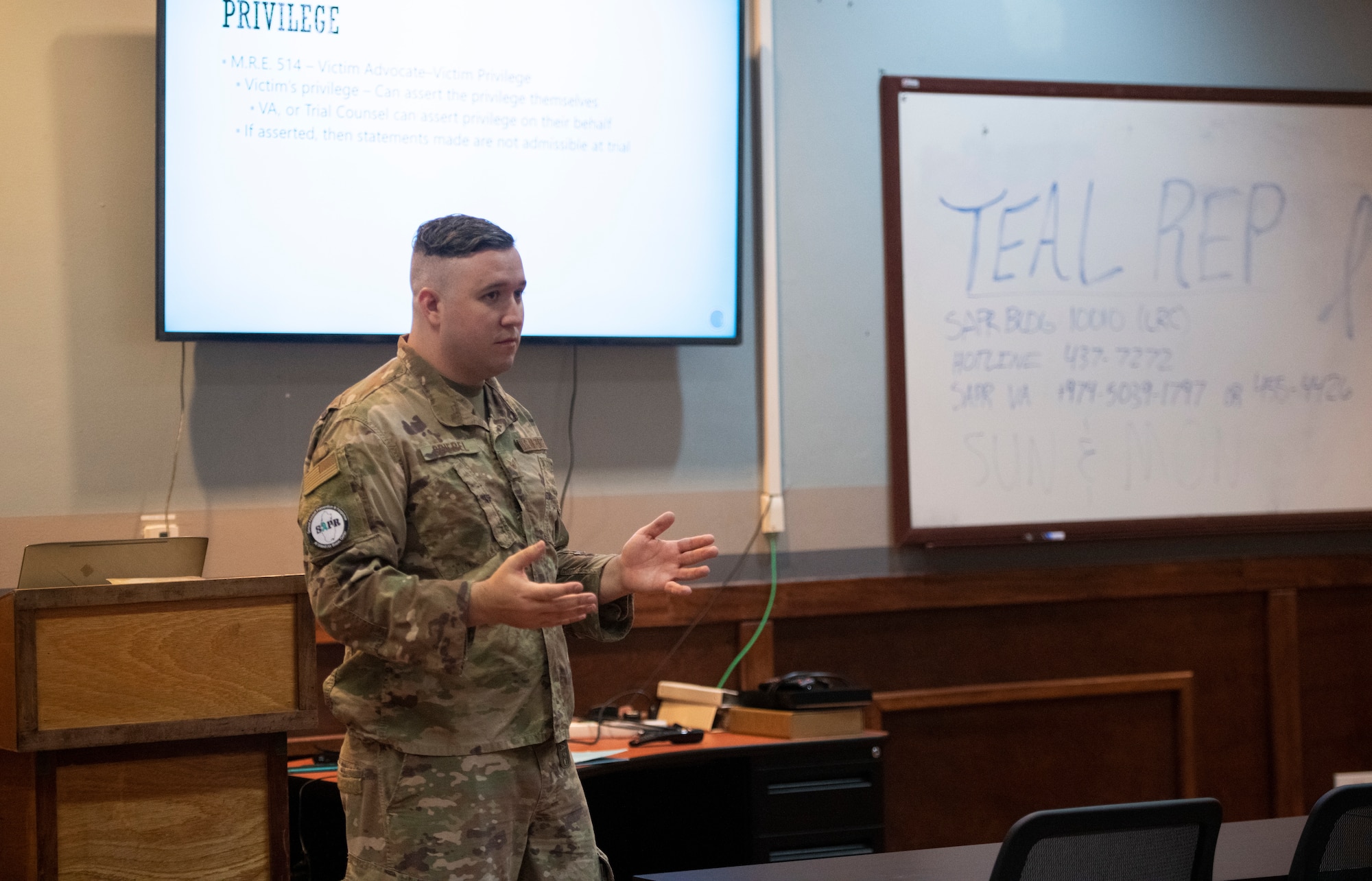 Airman instructs class of military members.