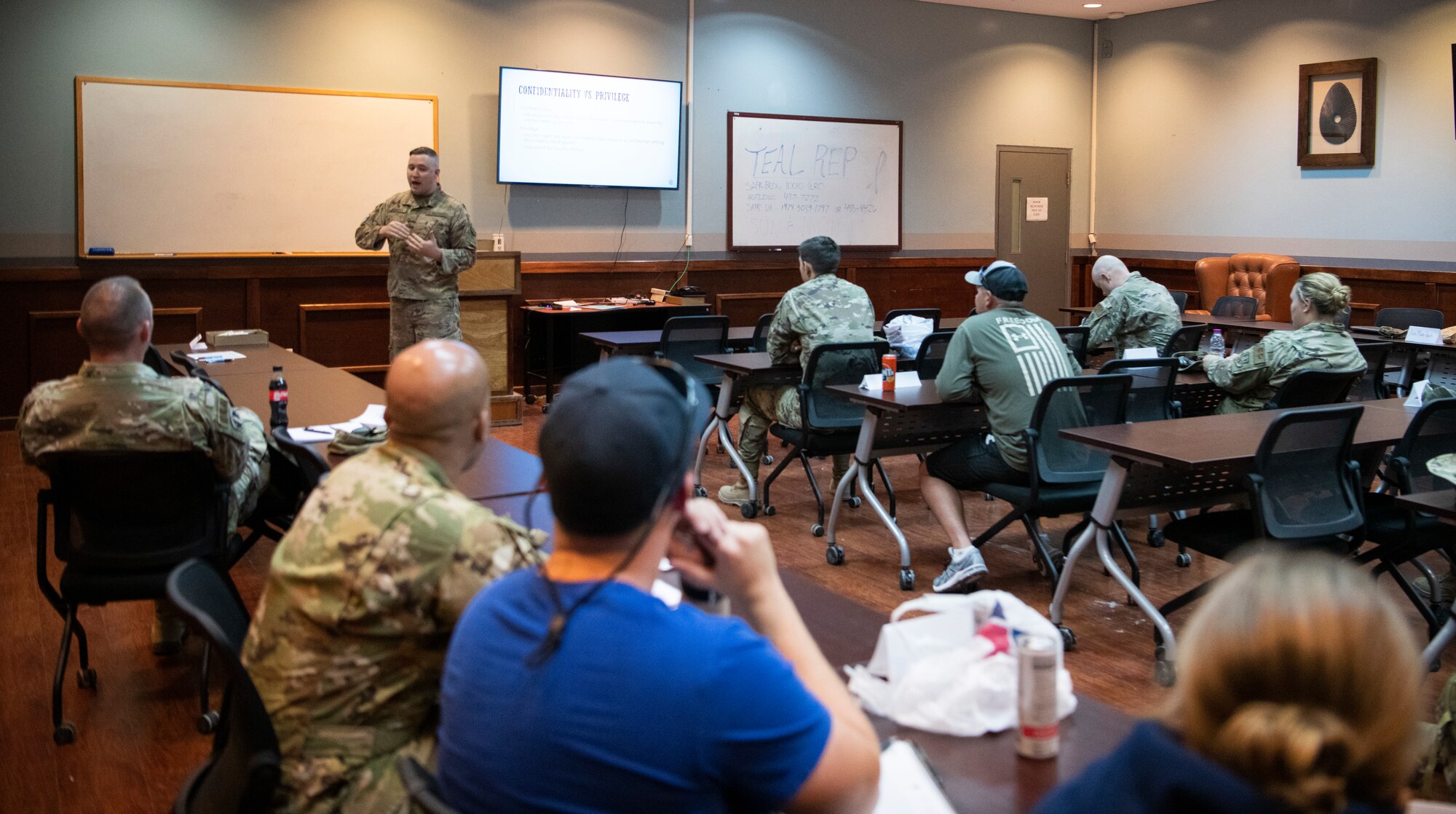 Airman instructs class of military members.