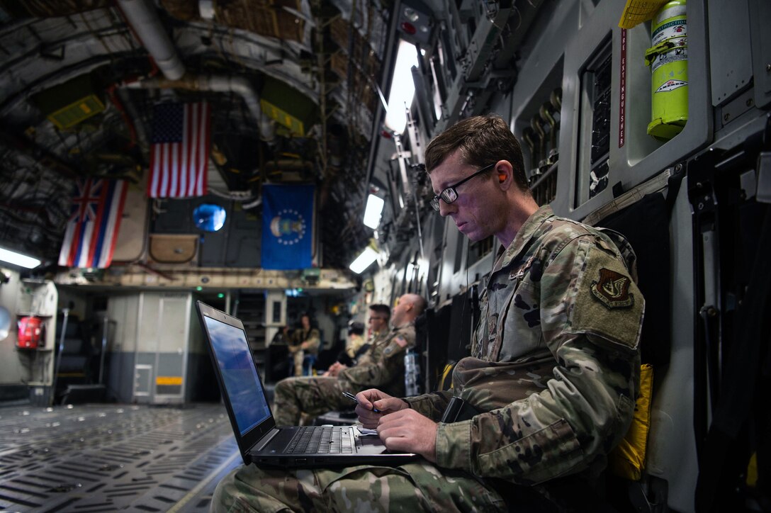 An Airman observes radio frequencies
