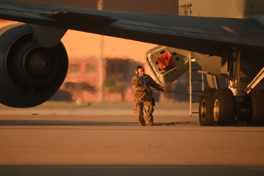 An Airman prepares a KC-135 Stratotanker for flight