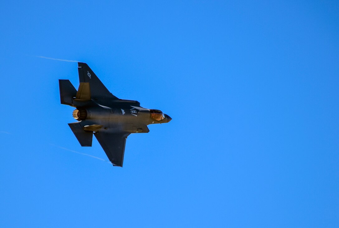 A F-35A flies in blue skies
