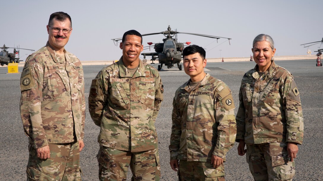 Four equal opportunity course instructors stand for a photo at Camp Buehring, Kuwait, November 9, 2021. U.S. Air Force Tech. Sgt. Malcolm Bentley, 386th Air Expeditionary Wing equal opportunity director, (second from the left), was an Air Force EO guest instructor for a day during a weeklong U.S. Army EO leaders course. (U.S. Air Force photo by Staff Sgt. Ryan Brooks)