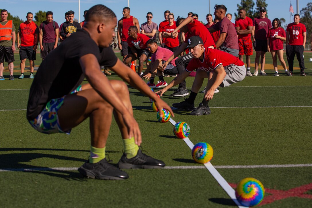 A group of Marines play dodgeball.