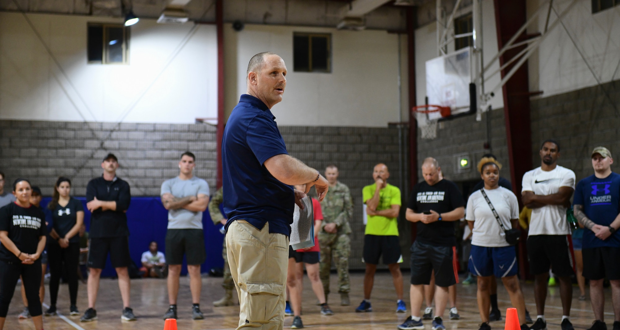 Airman addresses crowd during base event.