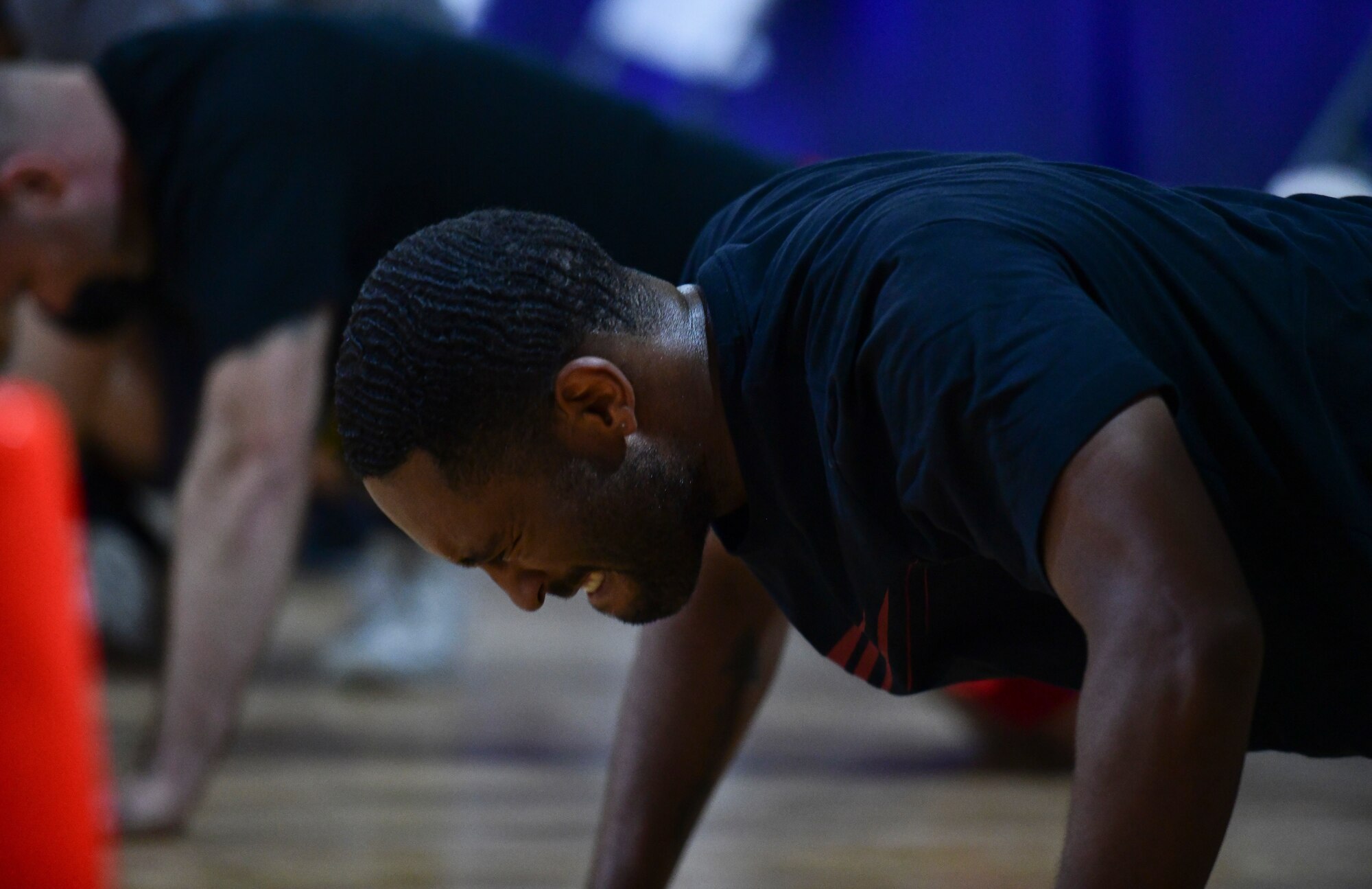 Airman does pushups during fitness event.