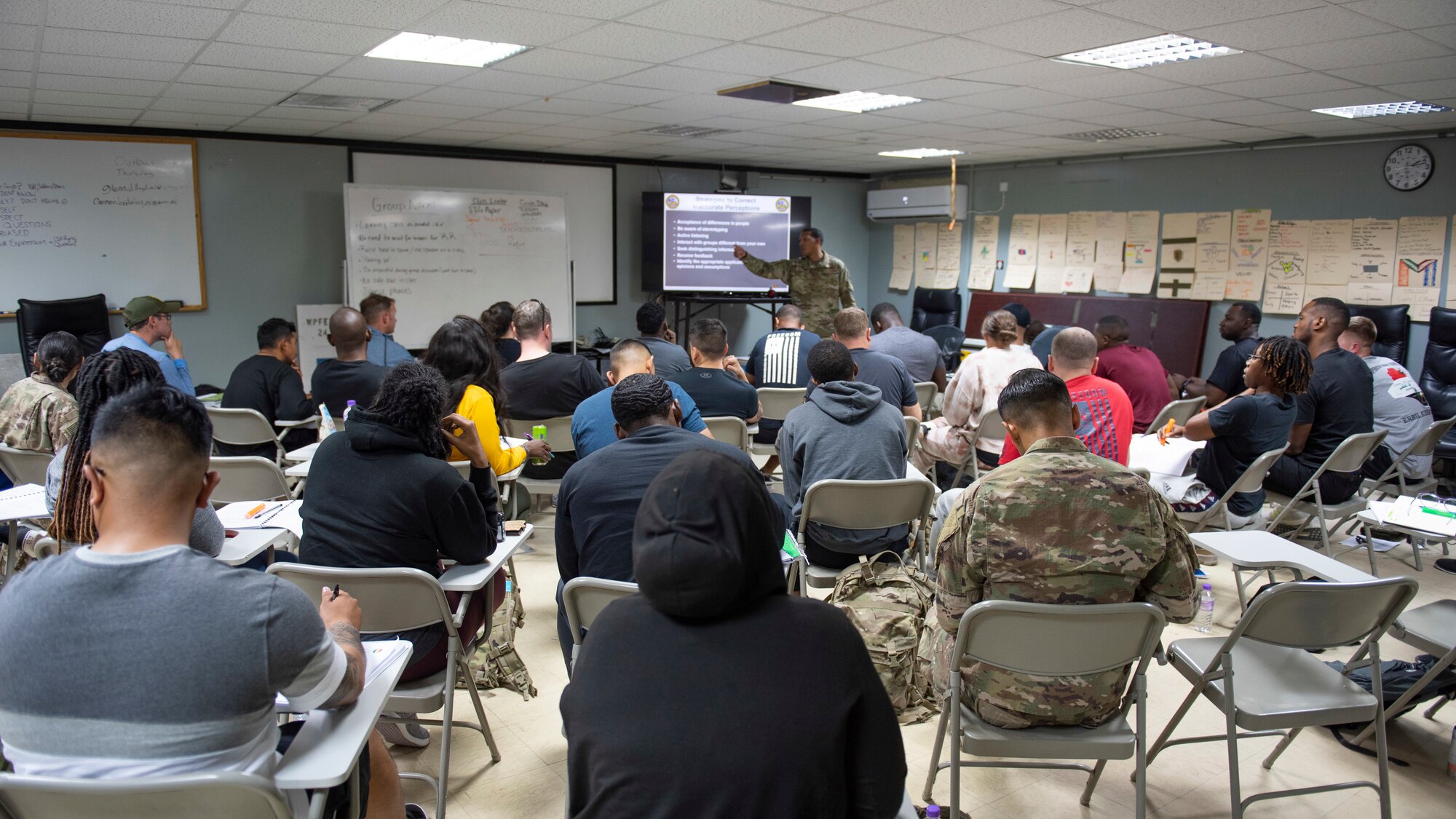 U.S. Air Force Tech. Sgt. Malcolm Bentley, 386th Air Expeditionary Wing equal opportunity director, calls on a student during a U.S. Army EO leaders course at Camp Buehring, Kuwait, November 9, 2021. Bentley was an Air Force EO invited to help instruct this course.  (U.S. Air Force photo by Staff Sgt. Ryan Brooks)