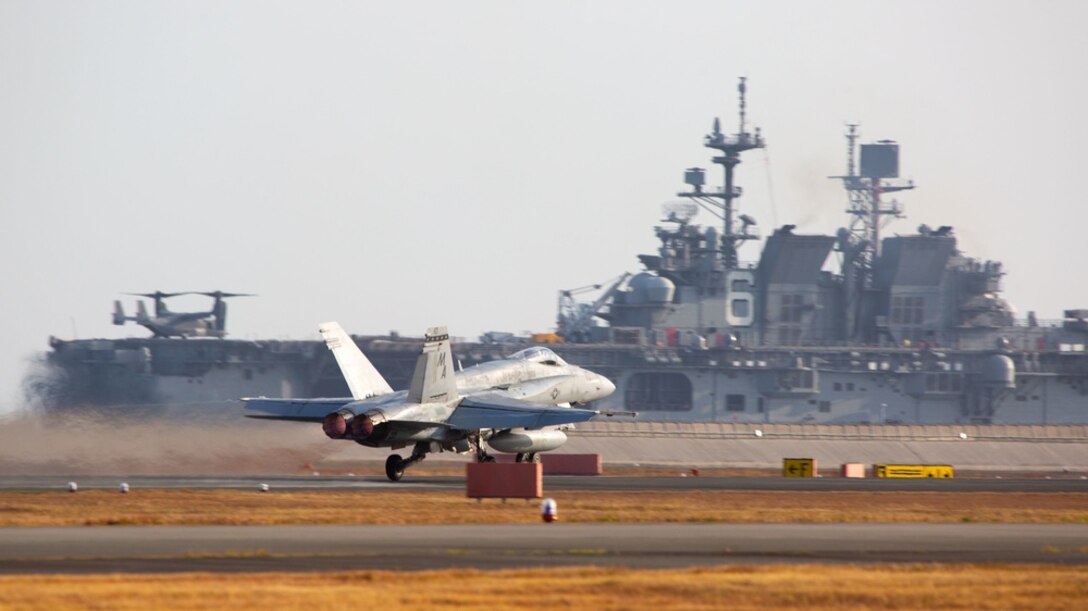 A U.S. Marine Corps F/A-18C Hornet aircraft with Marine Fighter Attack Squadron 112 takes off from Marine Corps Air Station (MCAS) Iwakuni, Japan, Nov. 18, 2021. VMFA-112 participated in a joint maritime strike rehearsal with the U.S. Navy off the coast of Okinawa, Nov 19, 2021. U.S. Marines with VMFA-112 routinely train and rehearse joint maritime mission sets in order to maintain readiness to carry out a wide range of operational tasks in a region characterized by vast oceans, seas, and waterways. (U.S. Marine Corps photo by Sgt. Booker T. Thomas III)