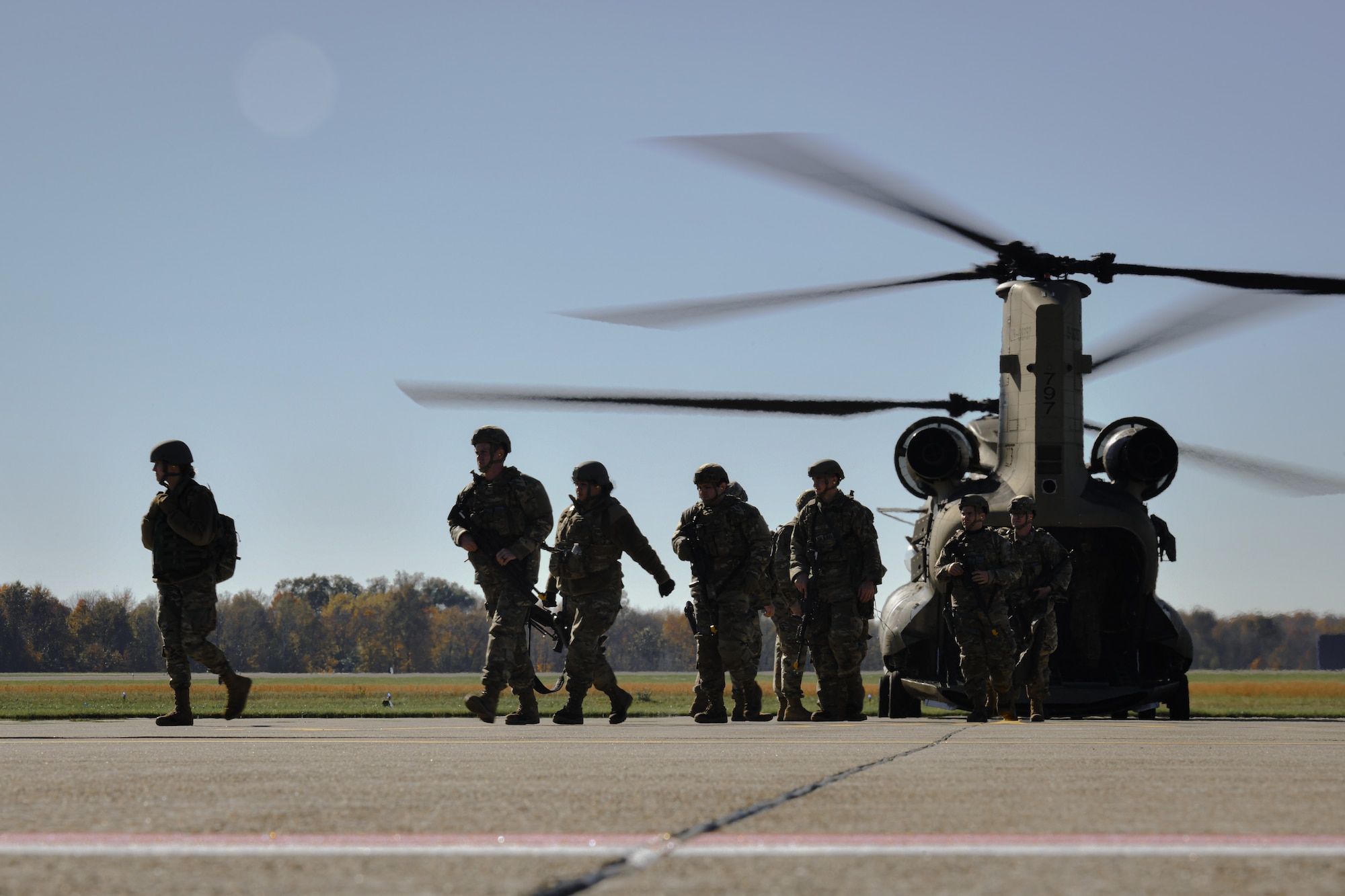 910th Security Forces Squadron members exit an Ohio Army National Guard CH-46 Chinook helicopter after combat training at Camp James A. Garfield Joint Military Training Center, Ohio, Nov. 6, 2021.