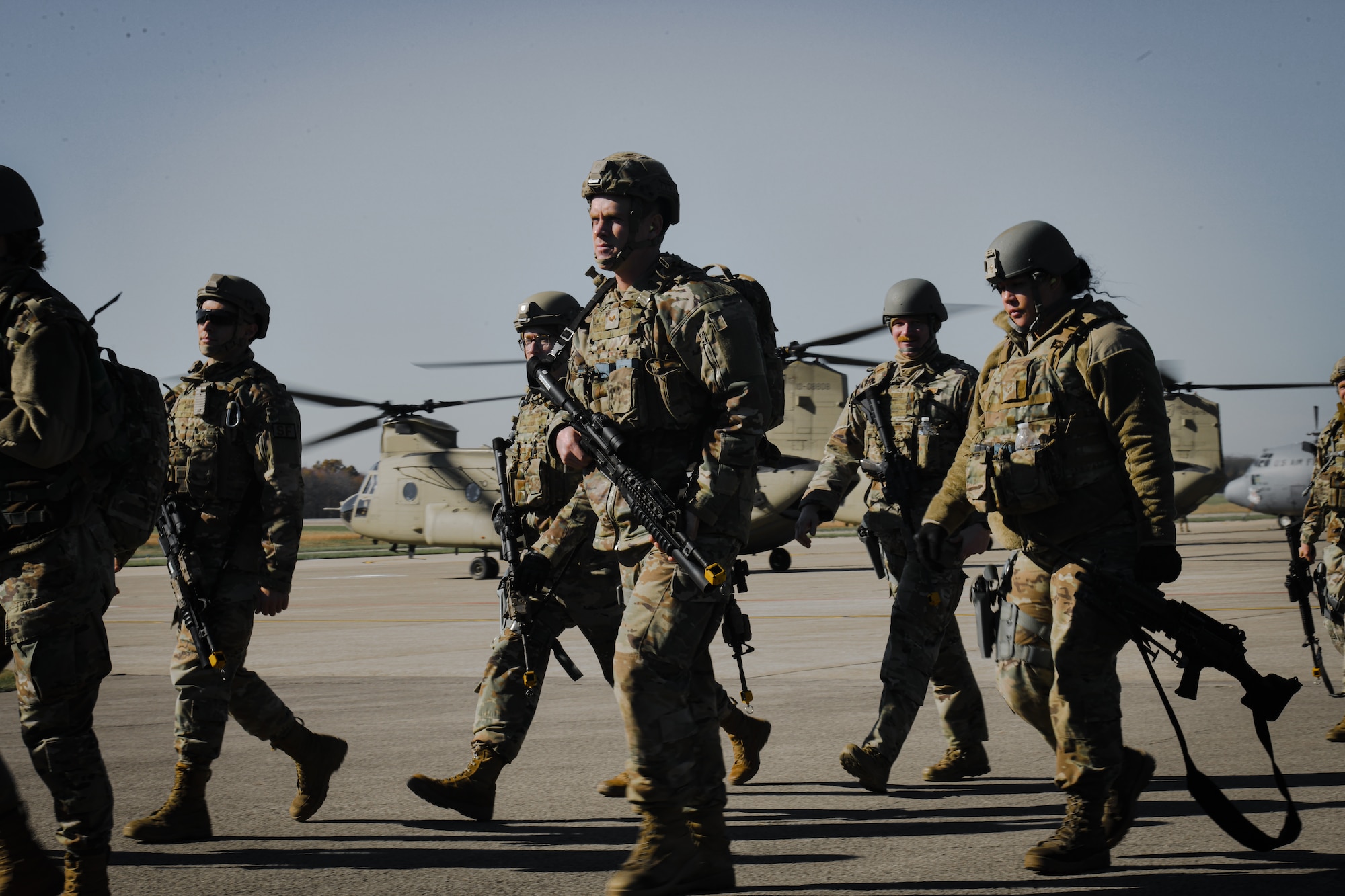 910th Security Forces Squadron members exit an Ohio Army National Guard CH-46 Chinook helicopter after combat training at Camp James A. Garfield Joint Military Training Center, Ohio, Nov. 6 2021.