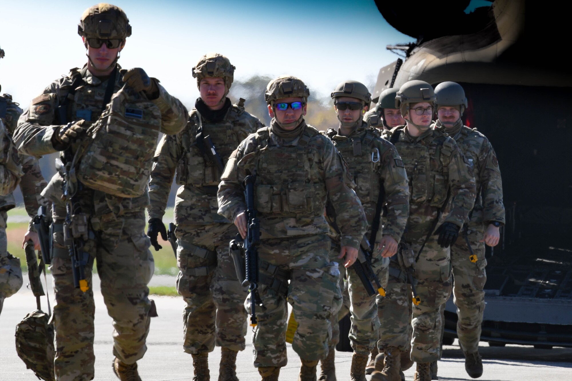 910th Security Forces Squadron members exit an Ohio Army National Guard CH-46 Chinook helicopter after combat training at Camp James A. Garfield Joint Military Training Center, Ohio, Nov. 6, 2021.