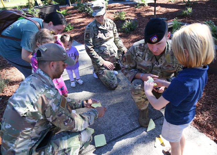 Image of 81st SFS Defenders interacting with children