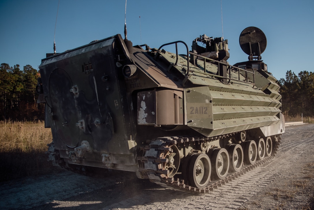 A U.S. Marine Corps AAV-P7/A1 assault amphibious vehicle with 2d Assault Amphibian Battalion (AABn), 2d Marine Division, idles before a live-fire range on Camp Lejeune, N.C., Nov. 17, 2021. 2d AABn trained with unmanned aircraft systems, remote weapon stations, and marathon targets in a live-fire environment to increase its capability to effectively and reliably support ship-to-shore movements and mechanized operations. (U.S. Marine Corps photo by Lance Cpl. Emma Gray)