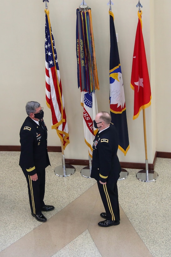 Retired Maj. Gen. Mark McQueen, former commanding general, 108th Training Command (IET), administers the officer oath of office to Maj. Gen. Mark E. Black, director of operations, J3 (Wartime) United States Forces Korea, during Black’s promotion ceremony, November 16, 2021, at the Joint Atrium, Marshall Hall, Fort Bragg, N.C.