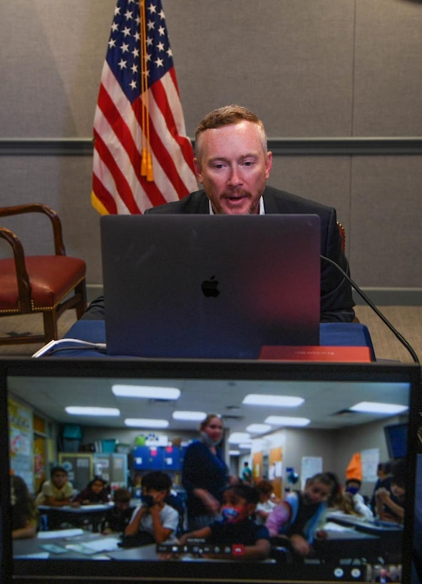 A Pentagon official speaks virtually to elementary school children.