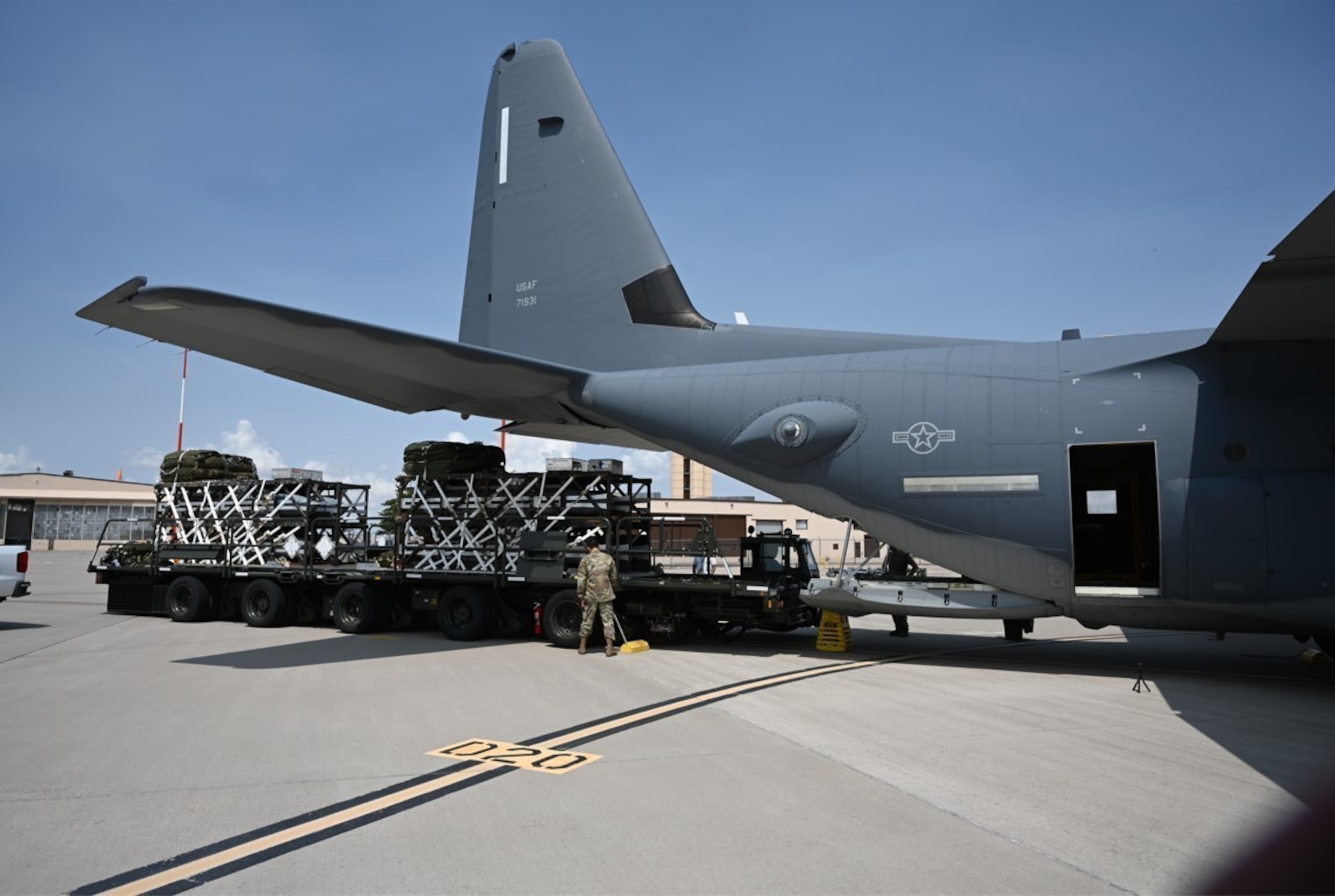 U.S. Air Force personnel load a Rapid Dragon deployment system onto an MC-130J aircraft ahead of an airdrop. Rapid Dragon is compatible with standard airlift inventory systems and provides a roll-on, roll-off capability with no aircraft modifications. (Courtesy photo)