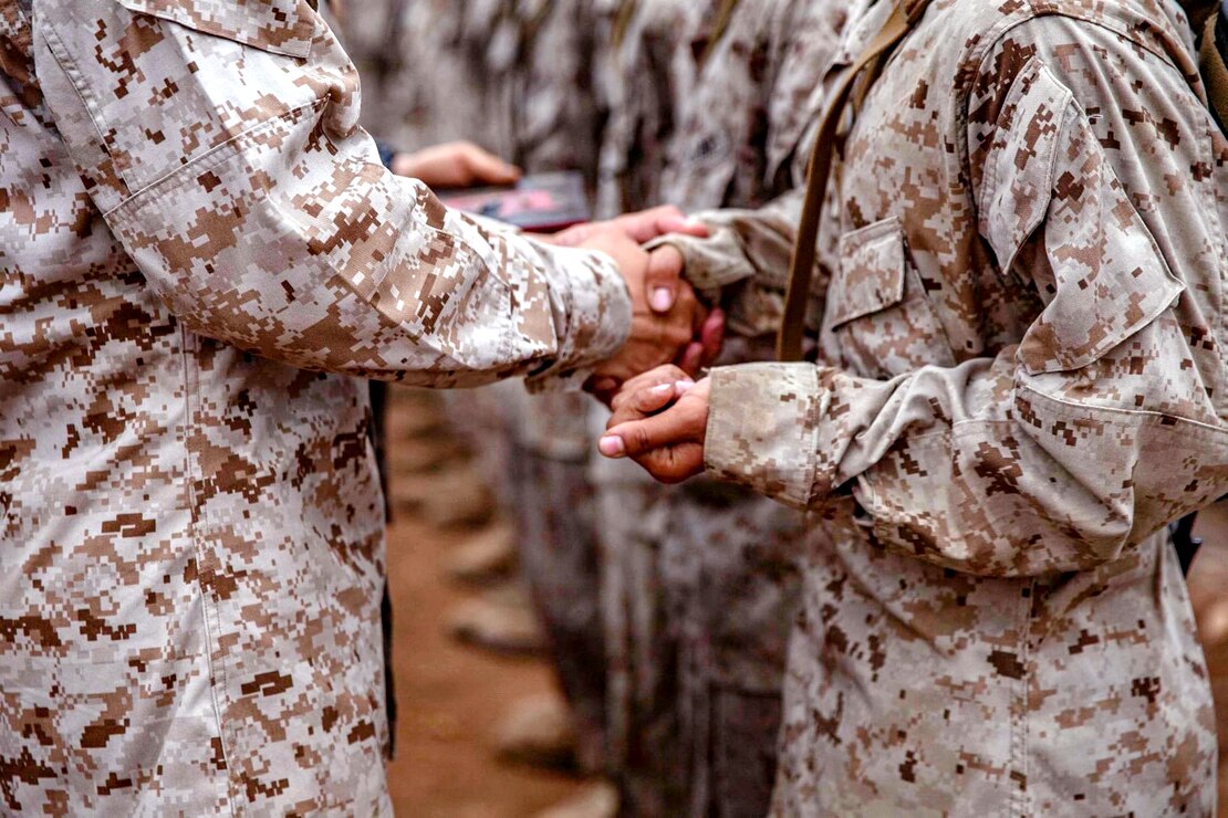 A U.S. Marine Corps Private with Delta Company, 1st Recruit Training Battalion receives his Eagle, Globe, and Anchor during the crucible at Marine Corps Base Camp Pendleton, Calif., Sept. 2, 2021.