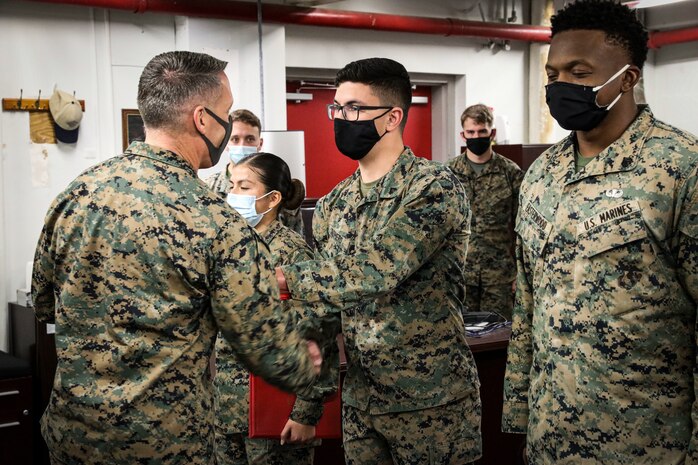 Indian Head, Md. (November 24, 2021) – U.S. Marines and Sailors from Chemical Biological Incident Response Force (CBIRF) receive awards for work above and beyond the call of duty in both the preparation and execution of a Commanding General’s Readiness Inspection (CGRI), aboard Naval Support Facility Indian Head, Md. on November 24, 2021. CGRI are extremely important to both the unit and the Commanding General, as it is a tool to allow the Commanding General to see exactly how effective and mission capable a unit is. Because of these Marines tireless efforts, CBIRF is mission capable, and continues our expeditious mindset of fighting the unseen enemy. (Official U.S. Marine Corps photo by Gunnery Sgt. Kristian S. Karsten/Released)