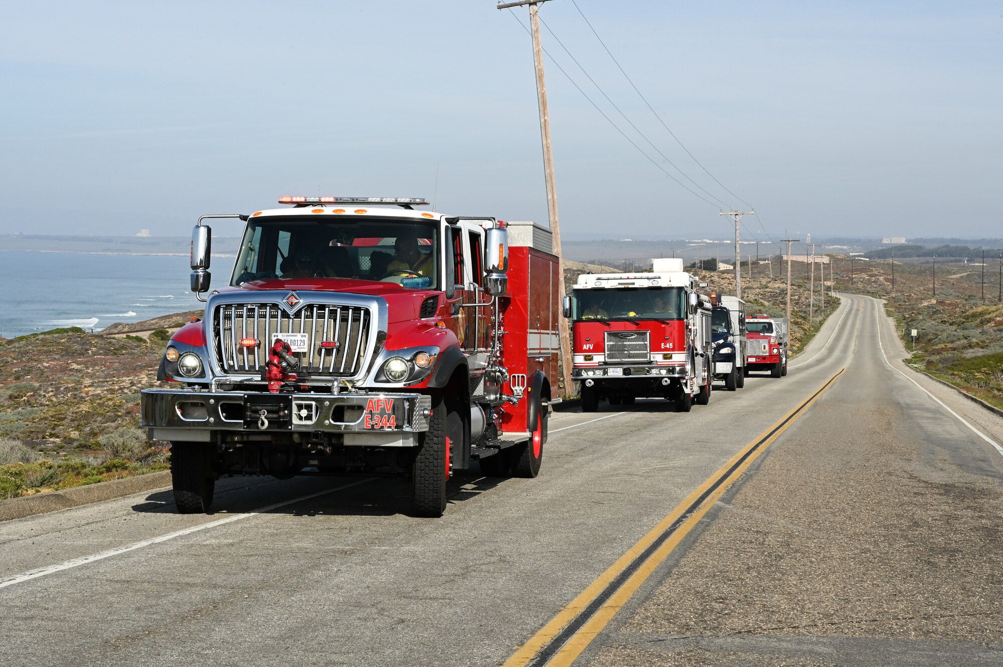 firetrucks parked on the side of the road