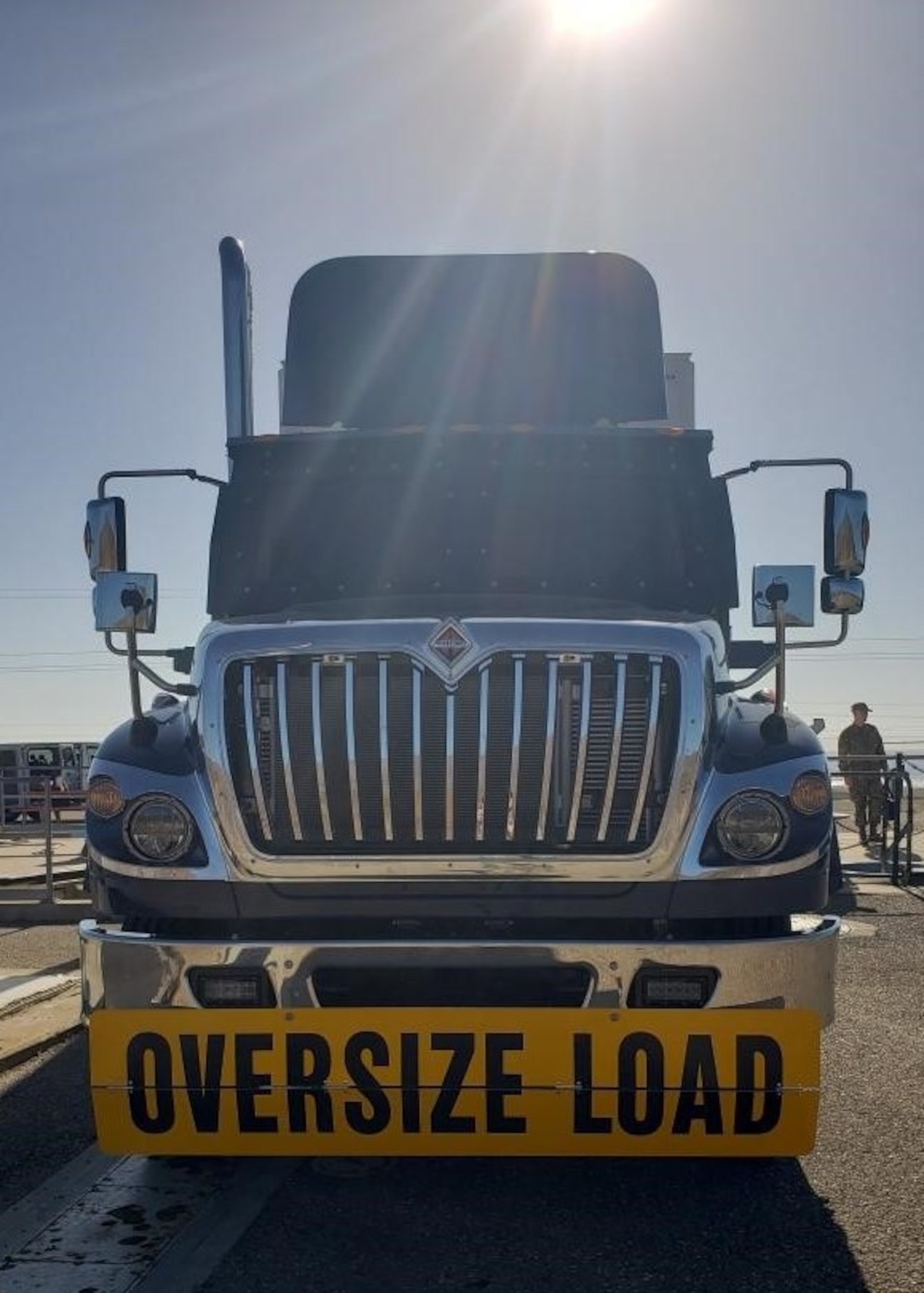 Airmen working near a large truck.