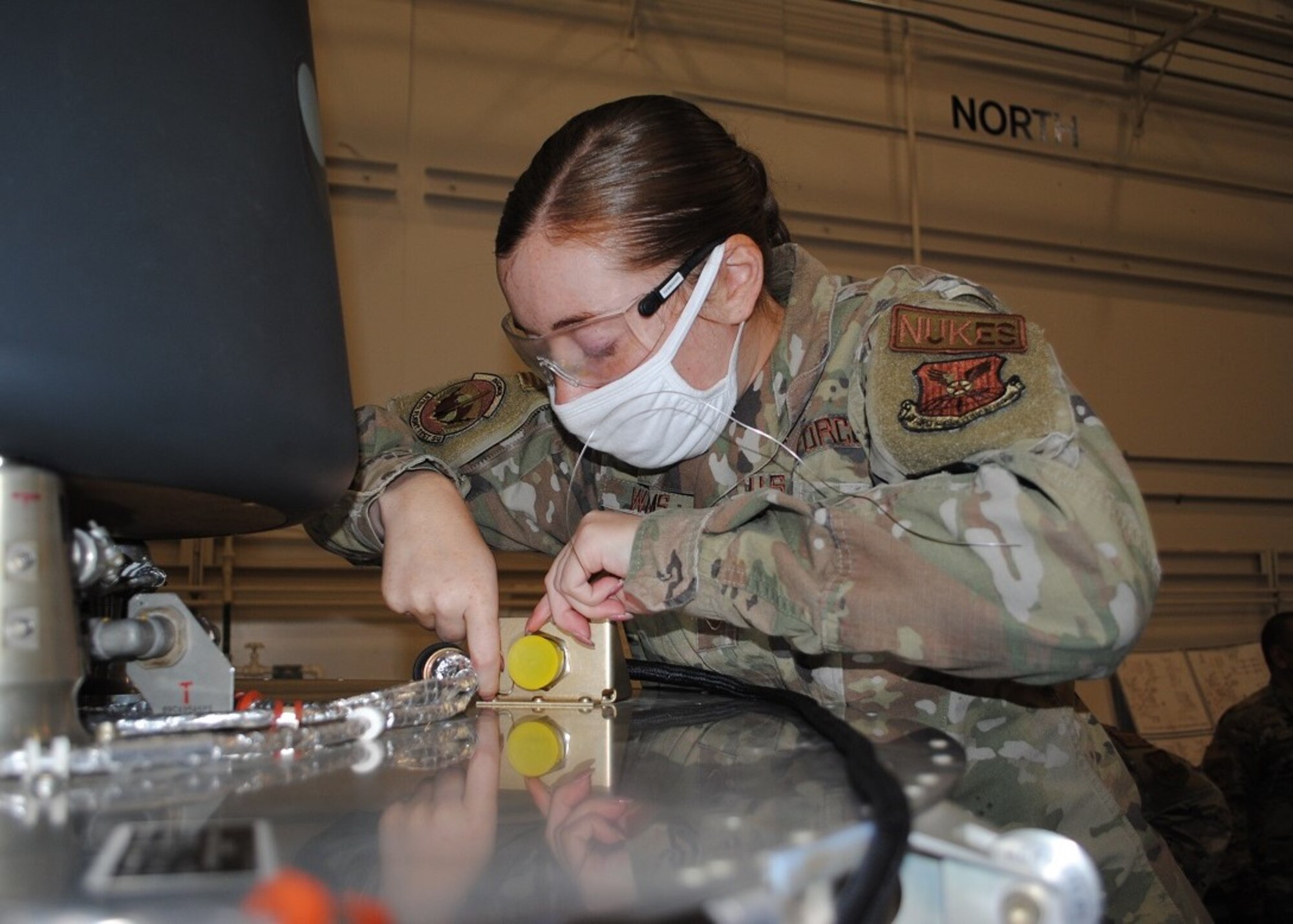 An Air Force NCO works on hardware.