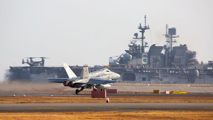 A U.S. Marine Corps F/A-18C Hornet aircraft with Marine Fighter Attack Squadron 112 takes off from Marine Corps Air Station Iwakuni, Japan, Nov. 18, 2021. VMFA-112 participated in a joint maritime strike rehearsal with the U.S. Navy off the coast of Okinawa, Nov 19, 2021. U.S. Marines with VMFA-112 routinely train and rehearse joint maritime mission sets in order to maintain readiness to carry out a wide range of operational tasks in a region characterized by vast oceans, seas, and waterways.