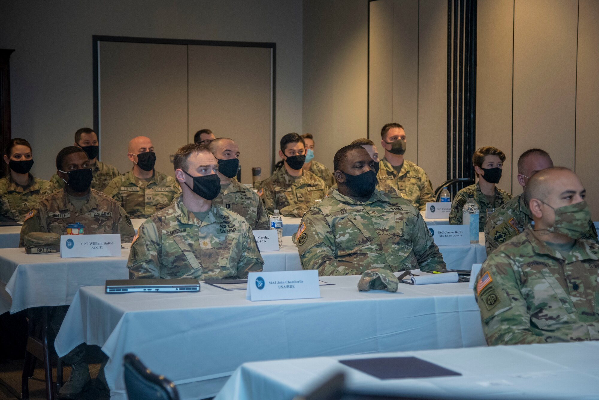 U.S. Space Force Guardians sitting at tables
