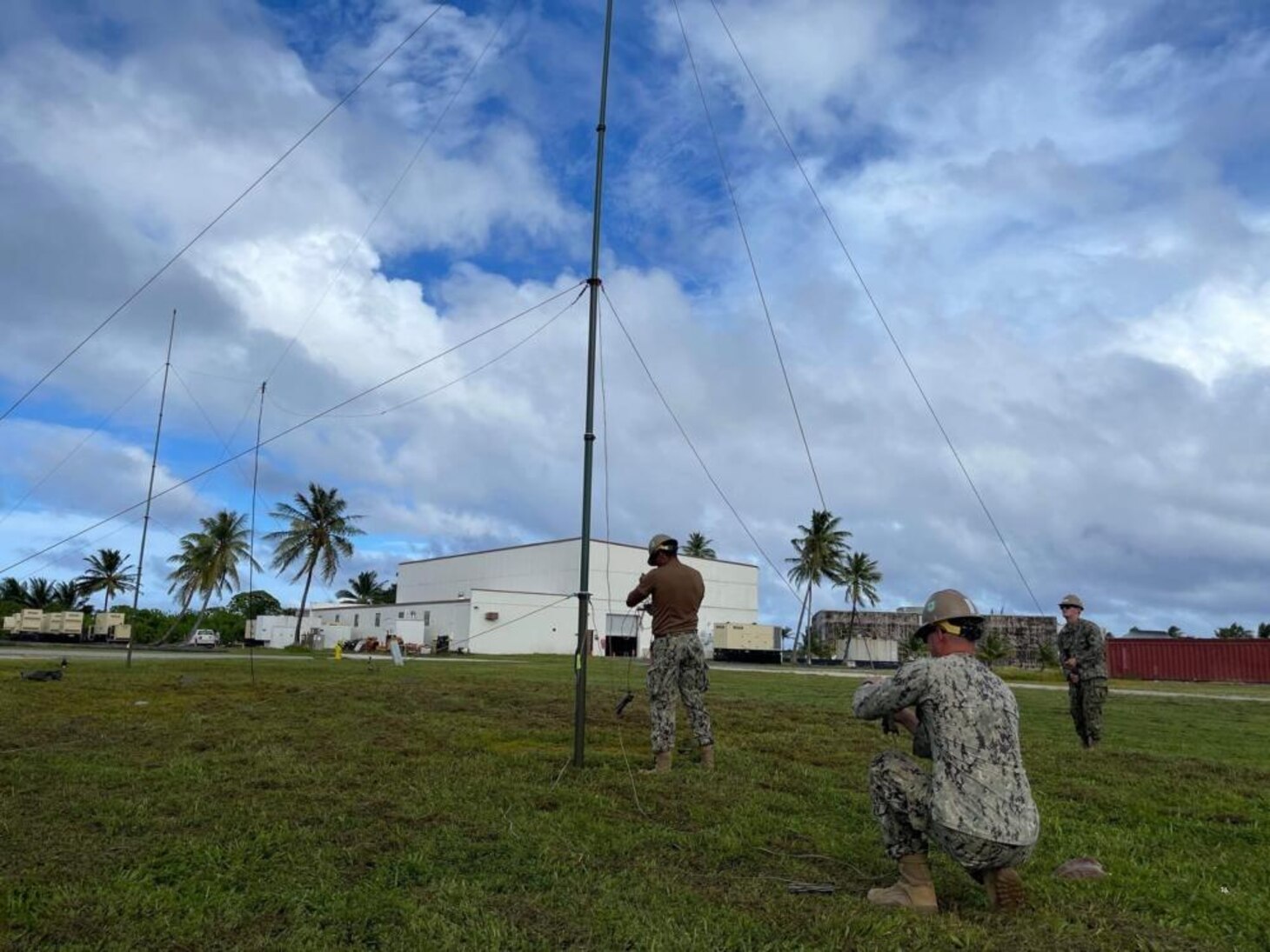 211122-N-CE120-1001 KWAJALEIN, Marshall Islands (Nov. 14, 2021) U.S. Navy Seabees with Naval Mobile Construction Battalion (NMCB) 5 set up an antenna during a joint Communications Exercise at Kwajalein, Marshall Islands. The U.S. Navy Seabees assigned to NMCB-5 are deployed to the U.S. 7th Fleet area of operations, supporting a free and open Indo-Pacific, strengthening their network of alliances and partnerships, and providing general engineering and civil support to joint operational forces. Homeported out of Port Hueneme, California, NMCB-5 has 13 detail sites deployed throughout the U.S. and Indo-Pacific area of operations. (U.S. Navy photo by Equipment Operator 2nd Class Brandon Blevins)