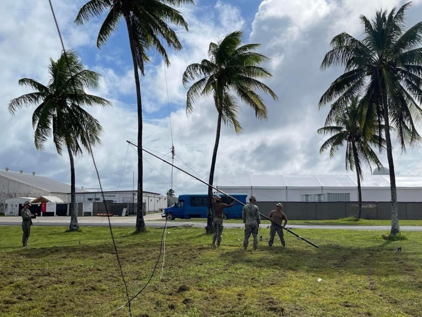 211122-N-CE120-1003 KWAJALEIN, Marshall Islands (Nov. 14, 2021) U.S. Navy Seabees with Naval Mobile Construction Battalion (NMCB) 5 set up an antenna during a joint Communications Exercise at Kwajalein, Marshall Islands. The U.S. Navy Seabees assigned to NMCB-5 are deployed to the U.S. 7th Fleet area of operations, supporting a free and open Indo-Pacific, strengthening their network of alliances and partnerships, and providing general engineering and civil support to joint operational forces. Homeported out of Port Hueneme, California, NMCB-5 has 13 detail sites deployed throughout the U.S. and Indo-Pacific area of operations. (U.S. Navy photo by Equipment Operator 2nd Class Brandon Blevins)