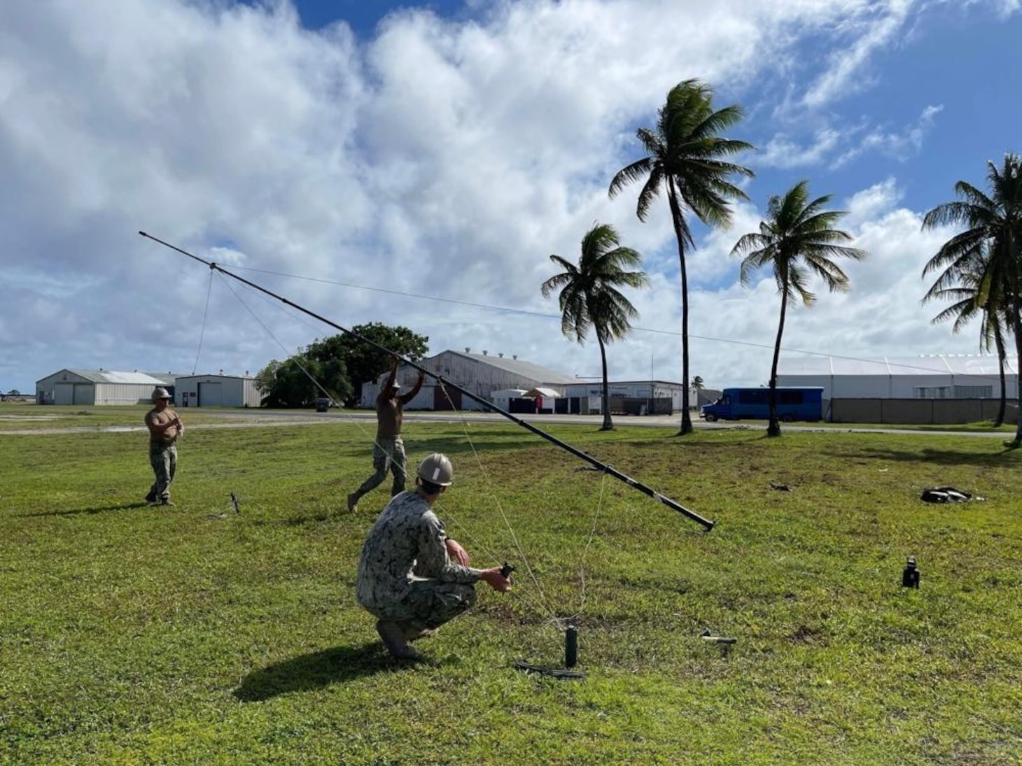 211122-N-CE120-1004 KWAJALEIN, Marshall Islands (Nov. 14, 2021) U.S. Navy Seabees with Naval Mobile Construction Battalion (NMCB) 5 set up an antenna during a joint Communications Exercise at Kwajalein, Marshall Islands. The U.S. Navy Seabees assigned to NMCB-5 are deployed to the U.S. 7th Fleet area of operations, supporting a free and open Indo-Pacific, strengthening their network of alliances and partnerships, and providing general engineering and civil support to joint operational forces. Homeported out of Port Hueneme, California, NMCB-5 has 13 detail sites deployed throughout the U.S. and Indo-Pacific area of operations. (U.S. Navy photo by Equipment Operator 2nd Class Brandon Blevins)