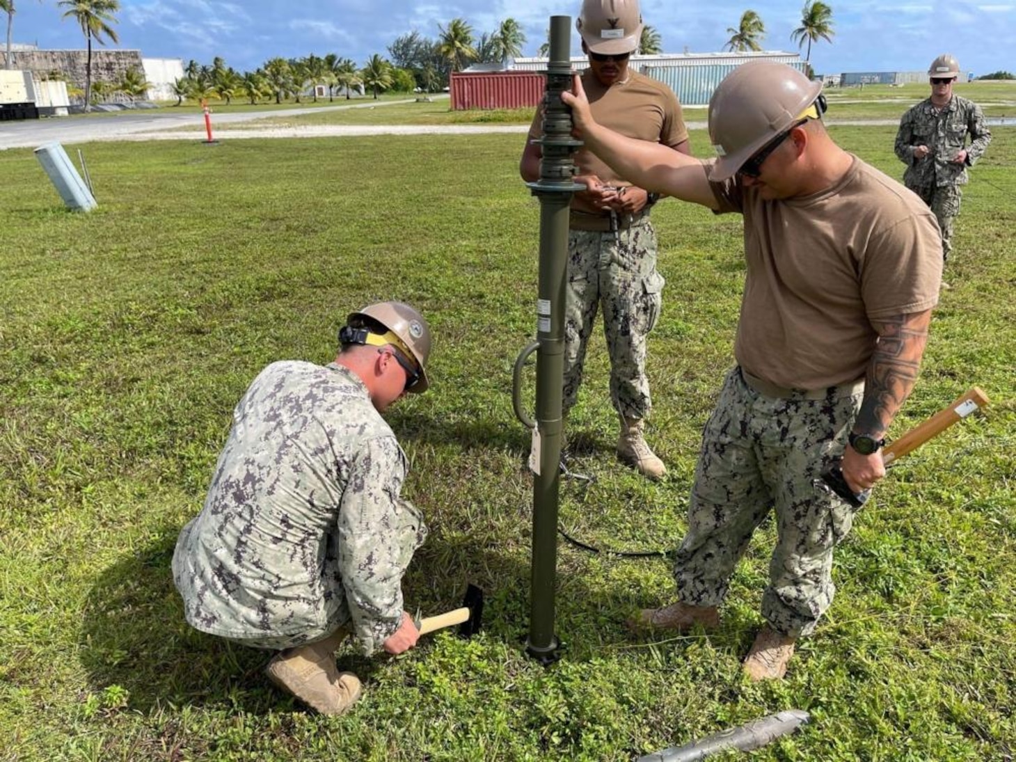 211122-N-CE120-1005 KWAJALEIN, Marshall Islands (Nov. 14, 2021) U.S. Navy Seabees with Naval Mobile Construction Battalion (NMCB) 5 set up an antenna during a joint Communications Exercise at Kwajalein, Marshall Islands. The U.S. Navy Seabees assigned to NMCB-5 are deployed to the U.S. 7th Fleet area of operations, supporting a free and open Indo-Pacific, strengthening their network of alliances and partnerships, and providing general engineering and civil support to joint operational forces. Homeported out of Port Hueneme, California, NMCB-5 has 13 detail sites deployed throughout the U.S. and Indo-Pacific area of operations. (U.S. Navy photo by Equipment Operator 2nd Class Brandon Blevins)