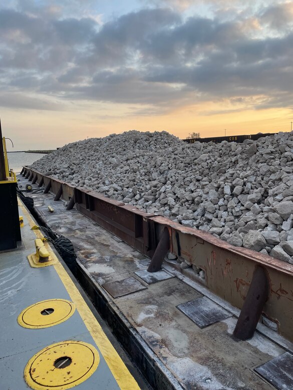 Grey stone on a metal barge.
