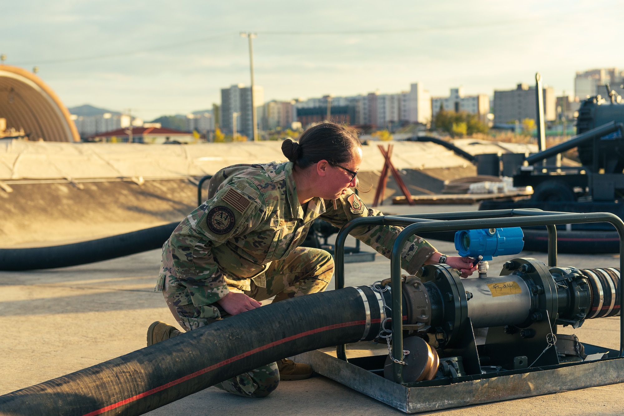 U.S. Air Force Maj. Sarah Smith, Seventh Air Force Logistics Division chief, resets a Fuels Operational Readiness Contingency Equipment (FORCE) meter at Daegu Air Base, Republic of Korea, November 1, 2021. The FORCE is a deployable modular fuel system capable of receiving, transferring and issuing petroleum products to support aircraft. (U.S. Air Force photo by Senior Master Sgt. Michael Coad)
