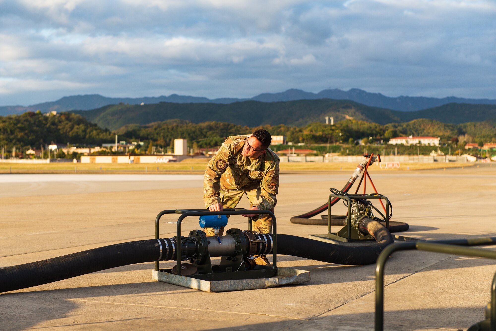 U.S. Air Force Master Sgt. Daniel Rey, Seventh Air Force Petroleum, Oil and Lubricants (POL) Contingency War planner, checks the meter to verify fuel movement while priming the system at Daegu Air Base, Republic of Korea, October 29, 2021. United States Air Force and Army units from across the Pacific recently combined to employ a Fuels Operational Readiness Contingency Equipment package, known in the POL community as FORCE. (U.S. Air Force photo by Senior Master Sgt. Michael Coad)