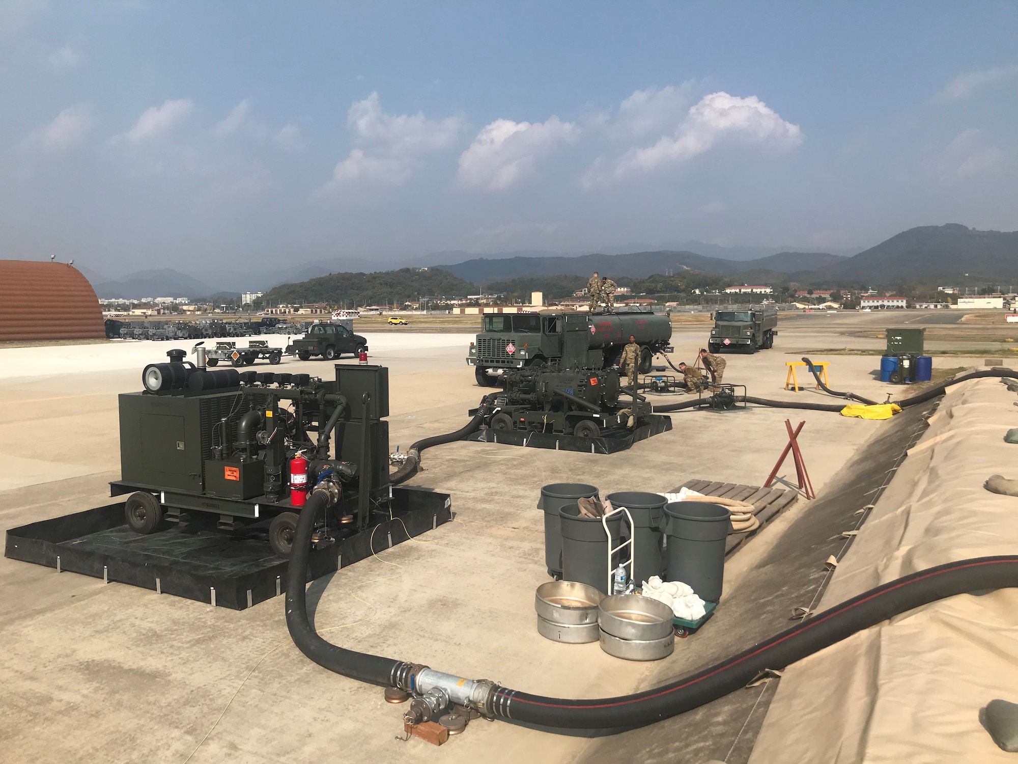 Fuels Operational Readiness Contingency Equipment (FORCE) components are lined up at Daegu Air Base, Republic of Korea, November 1, 2021. Petroleum, Oil and Lubricants personnel are responsible for monitoring the FORCE system while it waits to be filled. (U.S. Air Force photo by Senior Master Sgt. Michael Coad)