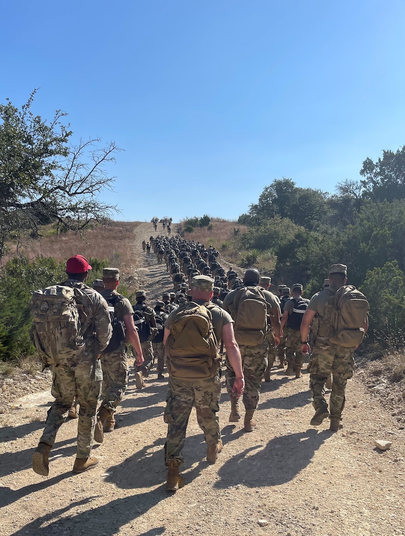 Airmen march along the trail at Camp Bullis