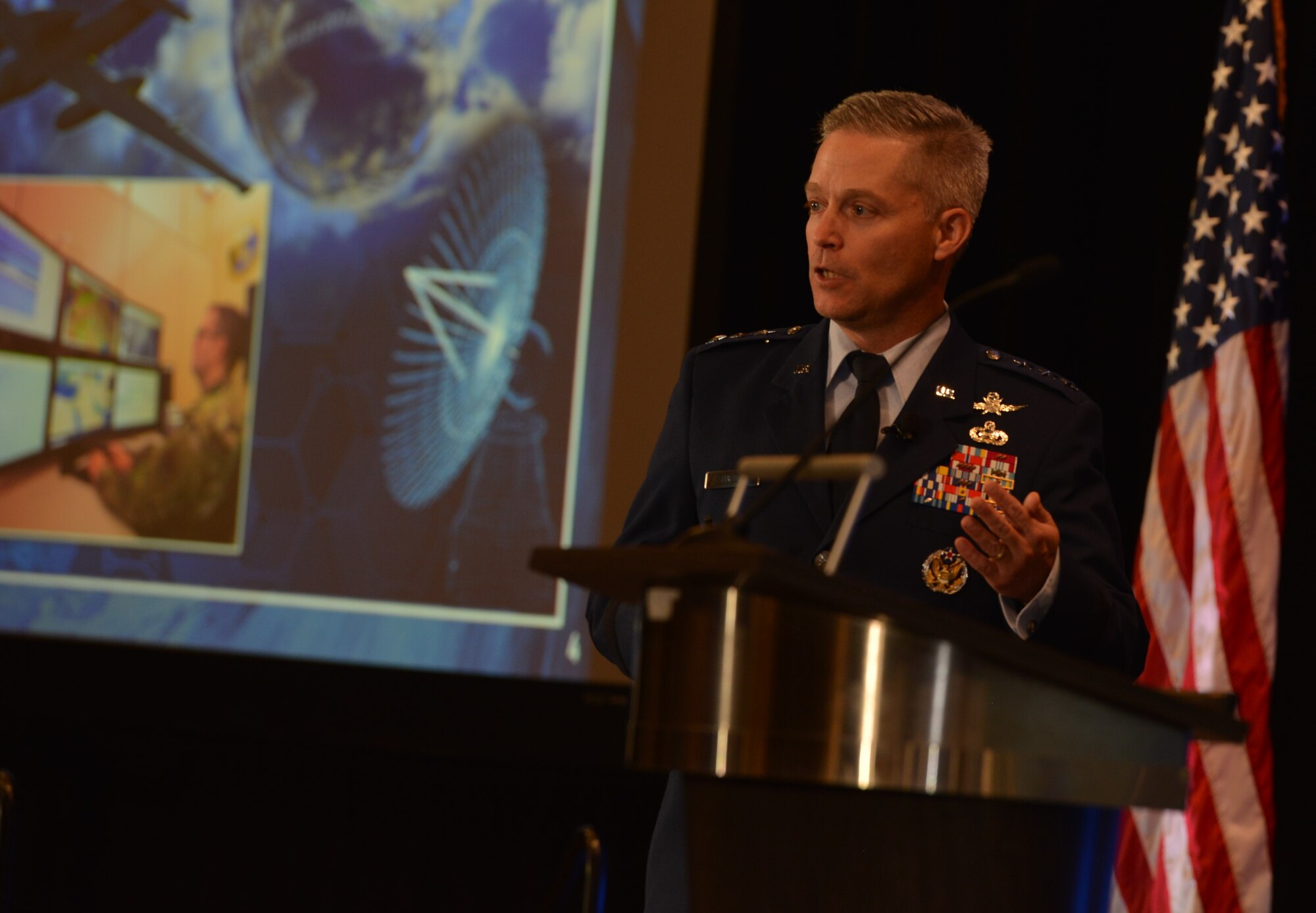 16th Air Force commander speaks at a podium.