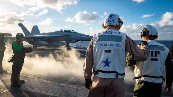 Japan Maritime Self-Defense Force (JMSDF) officers observe flight operations aboard the Nimitz-class aircraft carrier USS Carl Vinson (CVN 70) during Annual Exercise (ANNUALEX) 2021.