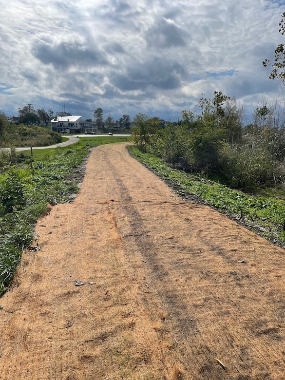 Seed cover on top of an earthen berm