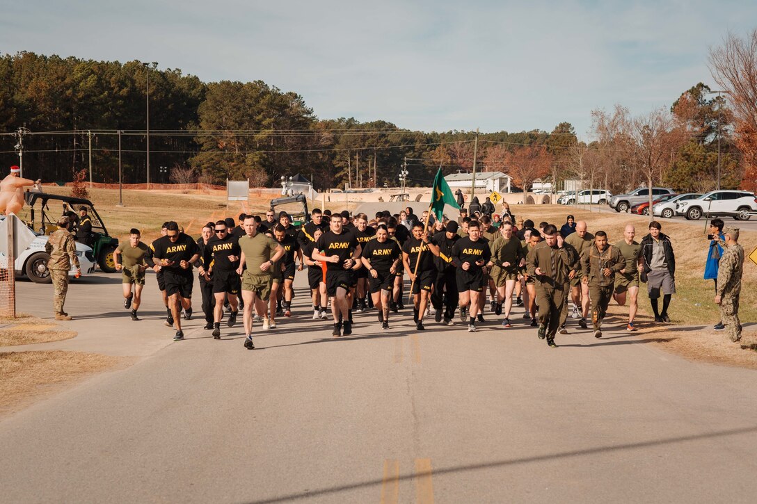 Interagency personnel and service members with Task Force Pickett participate in a Turkey Trot 5k on Fort Pickett, Virginia, Nov. 25, 2021. Interagency partners and service members of the 26th Marine Expeditionary Unit; 1st battalion 23rd Marine Regiment, 4th Marine Division; and 919th Military Police Company, New Mexico National Guard, participated in several activities in celebration of Thanksgiving.  (U.S. Marine Corps photo by Lance Cpl. Zachary Zephir)
