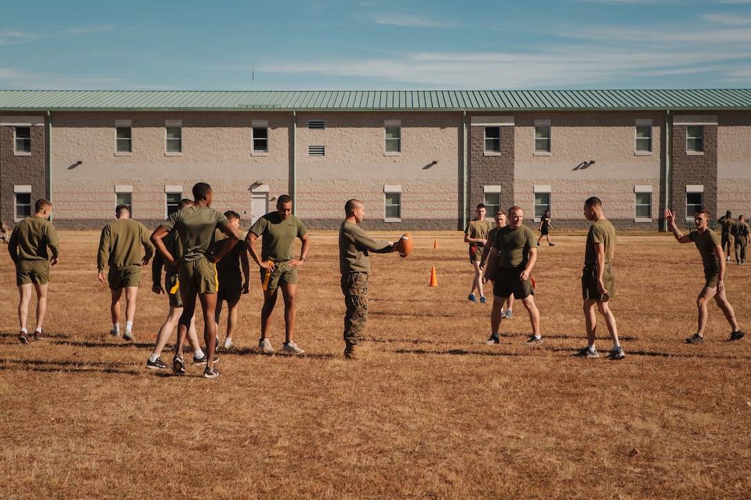 U.S. Marines assigned to the 26th Marine Expeditionary Unit participate in a flag football tournament on Fort Pickett, Virginia, Nov. 25, 2021.