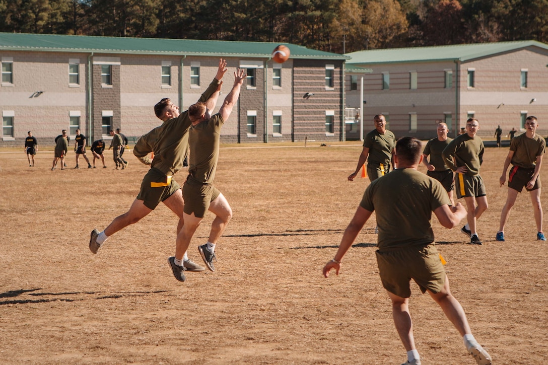 U.S. Marines assigned to the 26th Marine Expeditionary Unit participate in a flag football tournament on Fort Pickett, Virginia, Nov. 25, 2021.